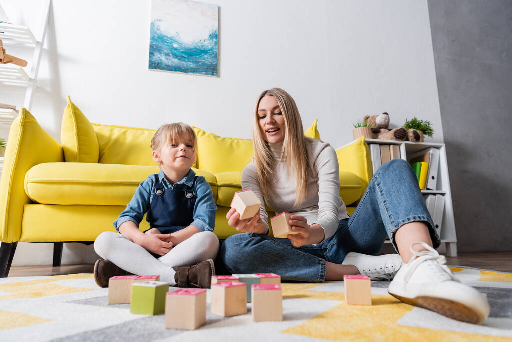 stock-photo-speech-therapist-girl-sitting-wooden